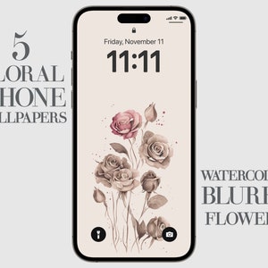 May include: A digital phone screen featuring a watercolour floral design. The background is a light beige colour. The flowers are in shades of pink and brown. The time is 11:11 and the date is Friday, November 11. The text "WATERCOLOR BLURRY FLOWERS" is at the bottom of the screen.