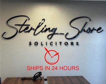 May include: Black and white sign with the text "Sterling-Shore Solicitors" and a red clock icon with the text "SHIPS IN 24 HOURS".