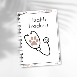 May include: A white spiral bound notebook with a brown paw print and stethoscope design. The cover reads "Health Trackers".