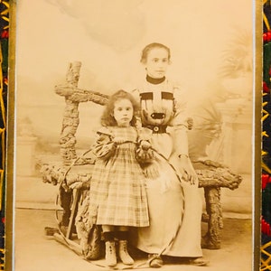 Mother and daughter with hoop ca 1870s