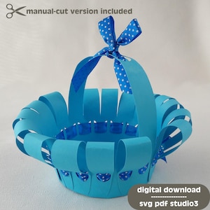 May include: A light blue paper basket featuring a woven design with looped edges and a handle tied with a blue and white polka dot ribbon. The text manual-cut version included and digital download svg pdf studio3 are visible on the image.