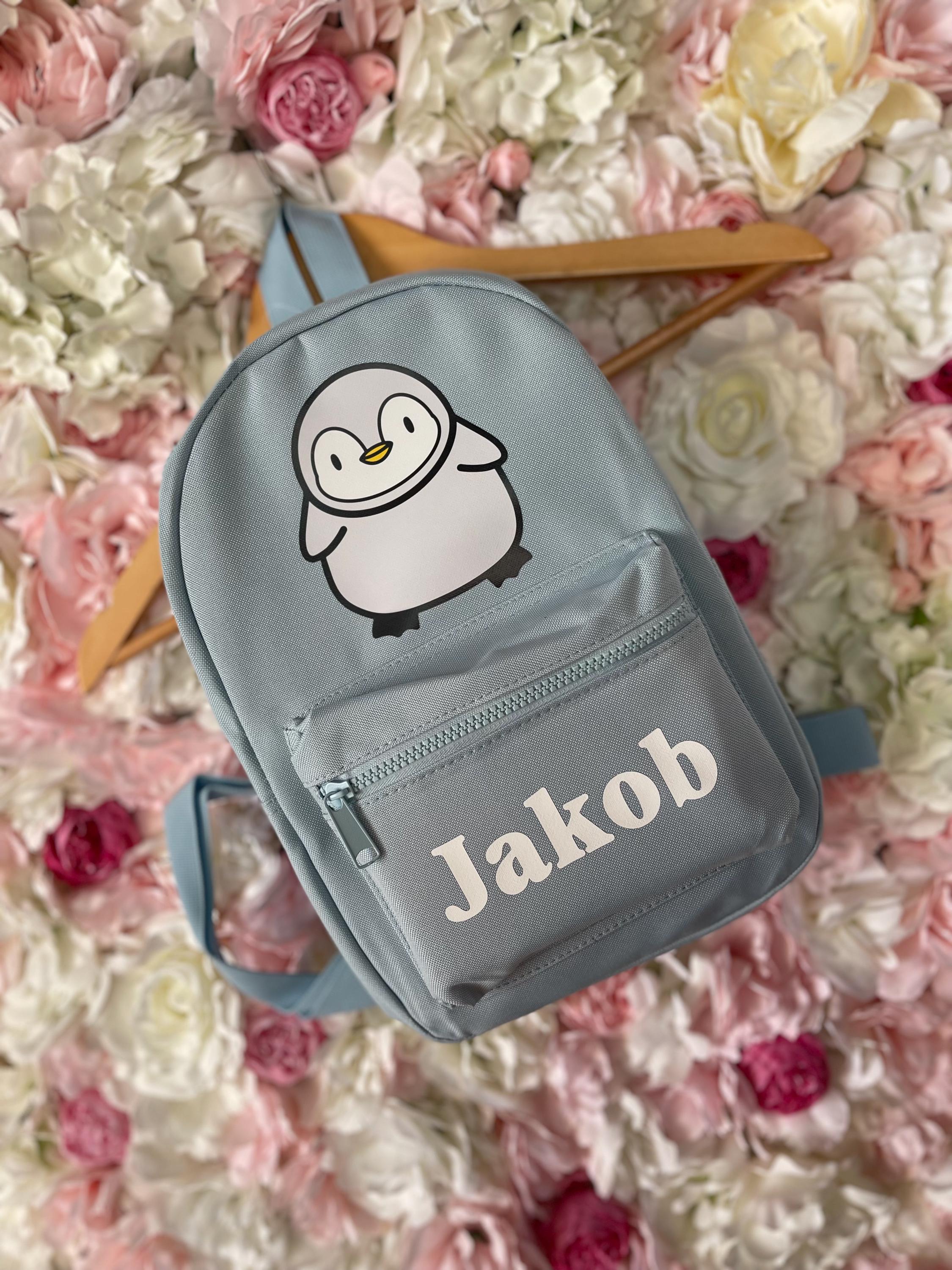 baby penguin in the kid backpack Buddy / Key Chain (3