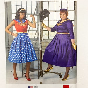 May include: A sewing pattern for a dress with a star print and a purple dress with a yellow belt. The pattern is for sizes 10-18, 36-44 Euro, and 38-46 French. The pattern is from Simplicity and is their 90th anniversary edition.