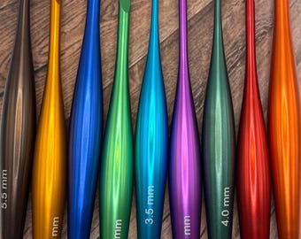 May include: A set of ten colorful crochet hooks, ranging in size from 3.5 mm to 6.0 mm. The hooks are made of metal and have a smooth, polished finish.