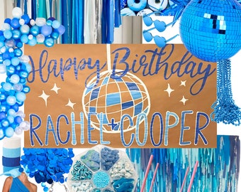 May include: A blue and silver disco ball themed birthday party decoration set. The set includes a banner that says "Happy Birthday Rachel + Cooper", blue and silver streamers, blue and silver balloons, blue and silver disco balls, and blue and silver donuts.