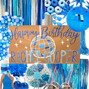 May include: A blue and silver disco ball themed birthday party decoration set. The set includes a banner that says "Happy Birthday Rachel + Cooper", blue and silver disco balls, blue streamers, blue and silver balloons, blue donuts, and blue and silver party favors.