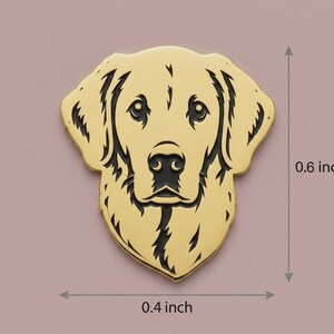 May include: A golden-colored metal pin in the shape of a Golden Retriever's head. The pin is 0.6 inches tall and 0.4 inches wide. The dog's features are detailed with black lines, including the eyes, nose, and mouth.