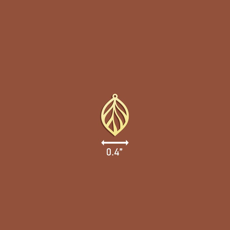 May include: Gold leaf charm with a delicate, intricate design. The charm is 0.4 inches in size.