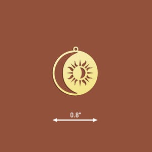 May include: Gold-coloured metal charm featuring a sun and moon design. The charm is 0.8 inches in diameter.