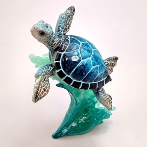 Blue Sea Turtle Figurine on Wave Painted Resin (1 turtle approx. 5+ inches) Blue Painted Resin Turtle on Wave for coastal home décor!