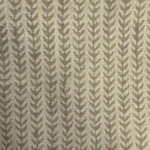May include: A close-up of a fabric with a repeating pattern of stylized, light brown leaf shapes. The leaves are arranged in vertical rows against a beige background, creating a textured, natural look.