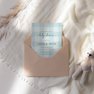 May include: A light blue and white gingham baby shower invitation with the text "You're invited to a baby shower" and "honoring Leah & Seth" in a script font. The invitation includes the date, time, and location of the event.