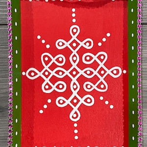 May include: A green and red tray with a white geometric design. The tray is decorated with a pink rhinestone border.