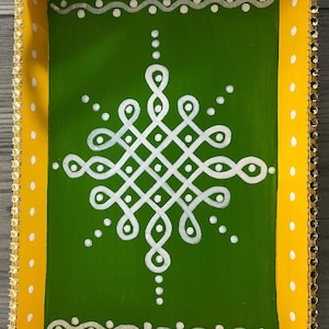 May include: A yellow wooden tray with a green center and white painted design. The tray has a heart-shaped cutout handle and a gold beaded trim.