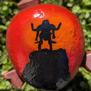 The Black Hole Maximillian painted river rock