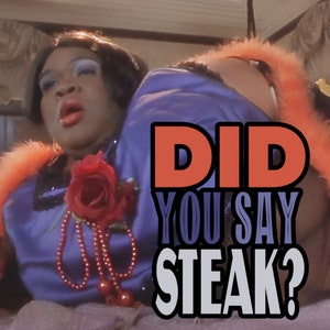 May include: A woman in a purple satin dress with a red rose and pearl necklace, looking surprised. The text "Did you say steak?" is in large, bold letters in front of her.
