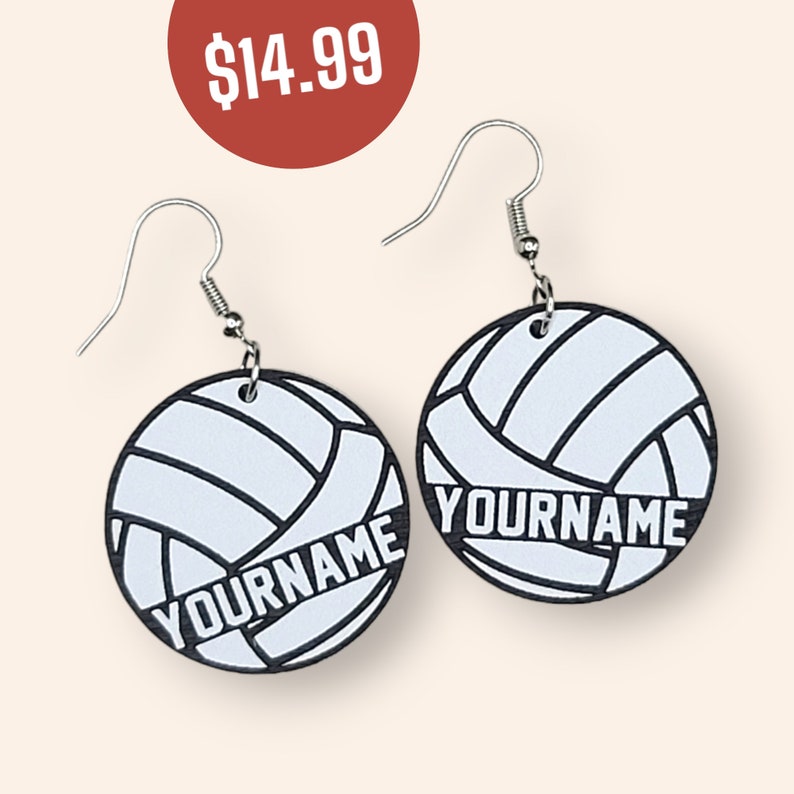 May include: A pair of black and white volleyball earrings with the text "YOURNAME" on each earring.