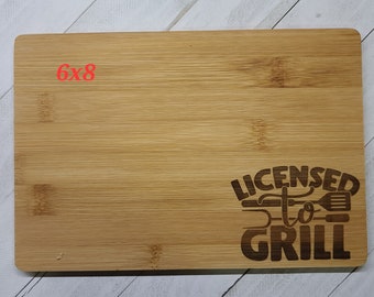 Bamboo small cutting board, "licensed to grill" laser engraved, approximate 6"x8"