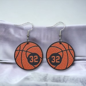 Personalized basketball earrings with a players jersey number. Made from lightweight acrylic, they measure 1/8" thick and 1.15" round. Great gift idea for basketball moms!
