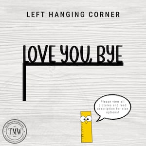 Black wood L-shaped door-corner signs reading “LOVE YOU, BYE” in bold letters. The Small version measures 10-3/4" wide × 6" tall, and the Large version measures 17-1/4" wide × 7-3/8" tall. Both are 1/4" thick and designed to perch on a door-frame corner without installation hardware.