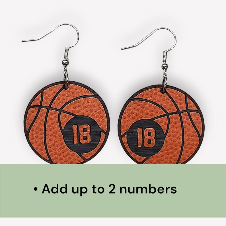 Personalized basketball earrings with a players jersey number. Made from lightweight acrylic, they measure 1/8" thick and 1.15" round. Great gift idea for basketball moms!