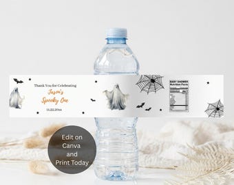 May include: A clear plastic water bottle with a white label featuring black spiderwebs, bats, and two ghost illustrations. The text reads Thank You for Celebrating Jason's Spooky One 11.22.20xx and includes a Baby Shower Nutrition Facts table.