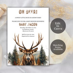 May include: A baby shower invitation with a woodland theme. The invitation features a brown deer with antlers in front of a forest background. The text on the invitation reads "Oh Deer! A sweet little buck is almost here! Please join us for a baby shower honoring Baby Jacob. Saturday, December 22, 20xx. 123 Parkway Avenue, Allentown, PA 18109. RSVP @ (123) 456-7899. Registered on Amazon."