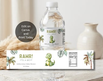 May include: A clear plastic water bottle with a white label featuring a green watercolor dinosaur, palm trees, and the text RAWR! IT'S A BOY! Ashley & Jay's Baby Shower 11.5.20xx. The label includes a nutrition facts panel for a baby shower.
