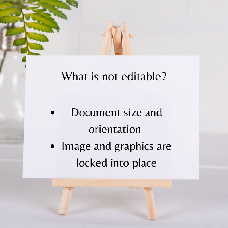 May include: A white card on a wooden easel with black text that reads "What is not editable?"  The text below the question reads "Document size and orientation" and "Image and graphics are locked into place."