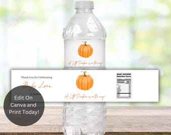 May include: Clear water bottle with a white label featuring an orange pumpkin graphic and the text "A Little Pumpkin is on the way!". Additional label reads "Thank You for Celebrating Baby Luna".