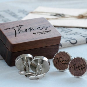 a couple of cufflinks sitting on top of a table