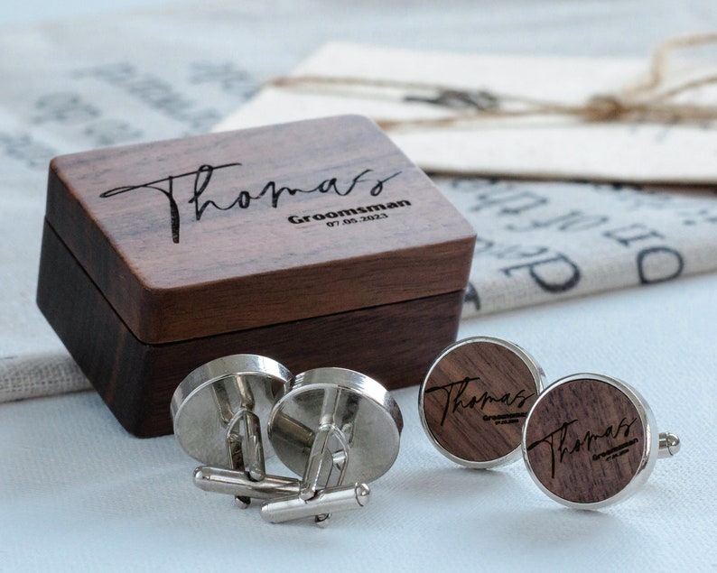 a couple of cufflinks sitting on top of a table