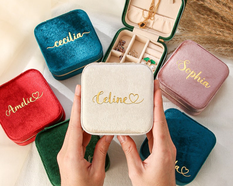 a person holding a small personalized jewelry box