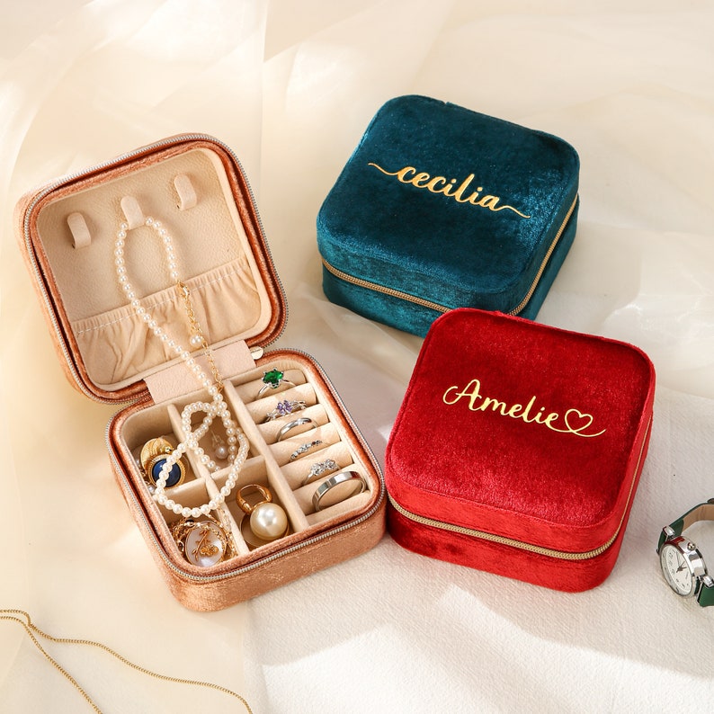 a couple of jewelry boxes sitting on top of a table