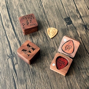 a wooden box with a heart and a wooden box with a musical note on it