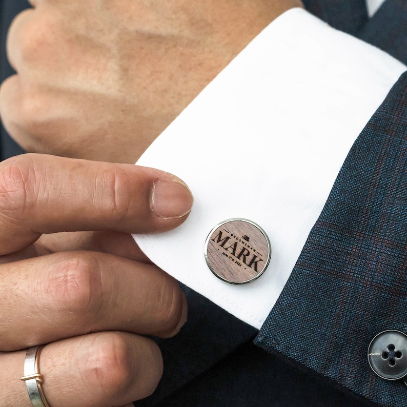 a close up of a person wearing a suit and tie