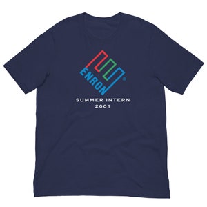 May include: Navy blue t-shirt with a white logo featuring a stylized multi-colored geometric shape and the text "Enron" and "Summer Intern 2001".