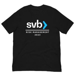 May include: Black t-shirt with a white logo that says "svb>" and "RISK MANAGEMENT 2023" underneath.