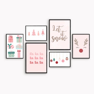 May include: A set of six pink and white Christmas-themed printable wall art prints. The prints feature a reindeer, Christmas trees, ornaments, and the text "Let it snow" and "fa la la la la la la".