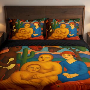 May include: A bedding set featuring a vibrant, colorful print inspired by Tarsila do Amaral's Abaporu. The design displays stylized figures in yellow and blue, a dark-skinned figure with a spoon, green cacti, and a large red fish on a landscape.