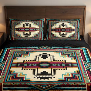 May include: A bed with a black comforter and two matching pillowcases. The bedding features a geometric pattern in cream, black, teal, burgundy, and gold. The headboard is made of dark wood, and there are two nightstands with lamps.