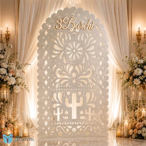 May include: A tall, arched, light-colored wooden panel featuring intricate laser-cut patterns of flowers, swirls, and cacti. The top section displays the text 3Barchi in a cursive font. The panel has a scalloped edge and a smooth finish.