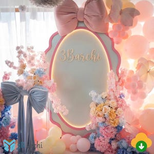 May include: A pastel-colored party backdrop featuring a large pink bow, a light blue oval frame with the text "3Barchi", and floral arrangements. Pink and yellow balloons and decorative butterflies complete the festive scene.