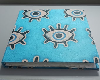 Handmade blue journal/sketchbook with blank pages, evil eye, 8"x8"