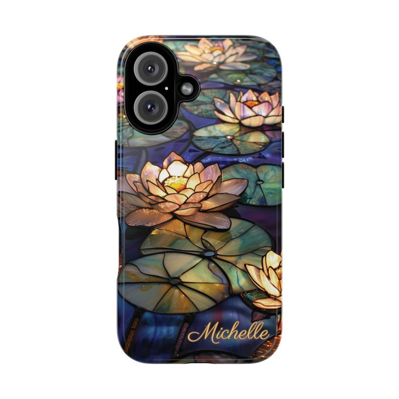 May include: A phone case with a stained glass design featuring water lilies in shades of blue, green, and yellow. The name "Michelle" is printed in gold script at the bottom of the case.