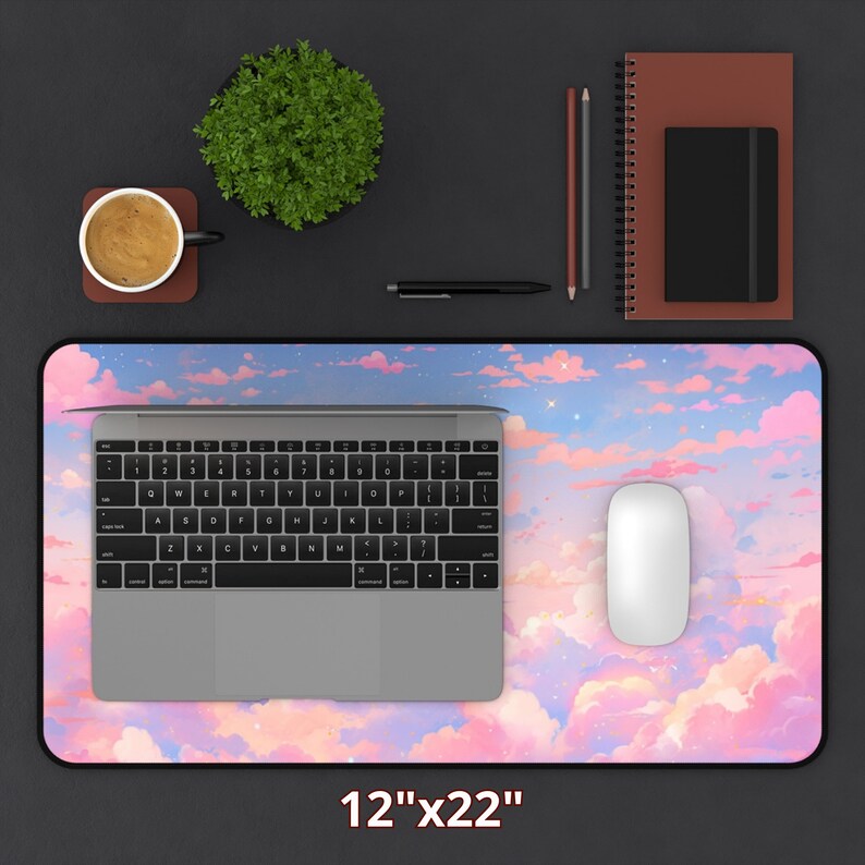 May include: A pink and blue desk mat with a cloud and star design. The mat is 12 inches by 22 inches.