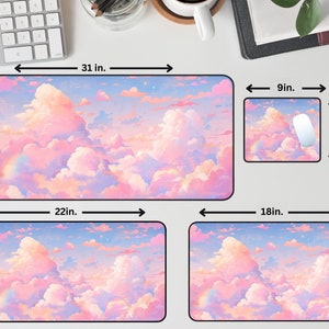 May include: Three different sizes of mouse pads with a pink and blue sky and clouds design. The largest mouse pad is 31 inches by 15.5 inches, the medium mouse pad is 22 inches by 12 inches, and the smallest mouse pad is 18 inches by 12 inches.