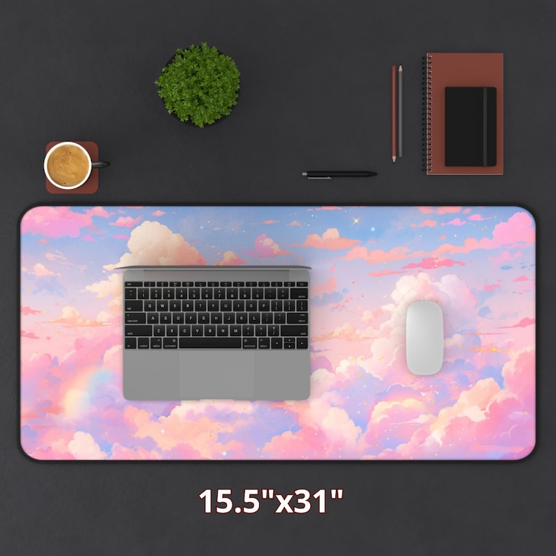 May include: A pink and blue desk mat with a cloud and star design. The mat is 15.5 inches by 31 inches.