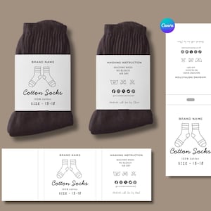 May include: Two pairs of dark brown cotton socks with white labels. The labels read "Cotton Socks" and include washing instructions and a size range of 15-18. The brand name is also displayed on the label.
