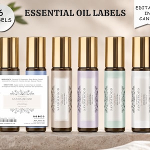 May include: Six cylindrical essential oil roller bottles with gold caps and pastel-colored labels featuring the text SANDALWOOD. A rectangular label template is displayed in the foreground with ingredient lists, directions, and a barcode.